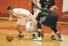 Wasilla sophomore Dane Kuiper and Colony senior Hunter Eisenhower scramble for the ball during Colony’s 60-39 win over Wasilla Saturday during the final day of Doc Larson’s Roundball Classic 