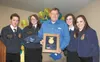 State FFA officers pose with Alaska Rep. Bill Stoltze after presenting him with the FFA’s Dedicated Service Award. Pictured are president Darien Cooke, state FFA vice president Rayna Nelson, 