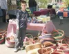 AMIE PAPPAS/Frontiersman Kurt Statz shows off some of the wares
he is selling from his booth at the weekly Friday Flings market in
downtown Palmer. The 9-year-old plans to use the proceeds fr