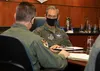 U.S. Air Force Gen. Kenneth Wilsbach, right, the Pacific Air Forces commander, talks to U.S. Air Force Brig. Gen. Anthony Stratton, left, the 176th Wing, Alaska Air National Guard commander, 