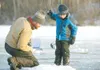 Eric Nelius and his son Zach, 5, look into their ice fishing
hole as the bait is lowered to the waiting fish that the two
spotted while fishing on Finger Lake in this Frontiersman file
photo.