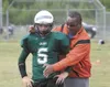 ROBERT DeBERRY/Frontiersman A Colony player gets instruction
from Lewis and Clark assistant coach Meadow Lemon during the
All-Alaska Football Camp at Colony High School Monday morning.