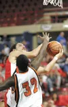 ROBERT DeBERRY/Frontiersman Wasilla guard Adrese Lavern goes up
for two points against Marquis Harris of the West Eagles during the
second period of Thursday’s first-round game at the ASAA/Fi