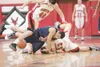 ROBERT DeBERRY/Frontiersman North Pole senior Luke Demientieff
gets tangled up with Houston forward Tyler Barron, left, and guard
Mitch Montreuil during a Patriots win over Houston at the 201