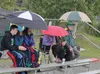 A group of hardy fans use umbrellas to brave heavy rain during the Mat-Su Miners 2015 home opener June 10 at Hermon Brothers Field. Despite the rain, more than 500 fans watched as Mat-Su scor