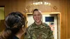 U.S. Air Force Staff Sgt. Benjamin Raughton, 18th Wing Public Affairs photographer, greets a Japanese customer at Kadena Air Base, Japan, Jan. 8, 2020. Raughton's ability to communicate in Ja