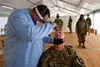 A Soldier receives a COVID-19 test as part of a preventative measure during Phase II of DEFENDER-Europe 20, July 15, 2020, in Drawsko Pomorskie Training Area, Poland. In response to the virus