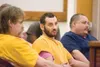 ROBERT DeBERRY/Frontiersman Jeremy Christopher Nelson, 37,
center, entered a plea of not guilty at his first appearance in
court Monday. Nelson is accused of fatally shooting Robert Carey,
66