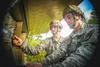 Two Non-commissioned Officers with the 146th Expeditionary Signal Battalion troubleshoot an Sattelite Transportable Terminal (STT) during the Best of the Best Competition, Saturday, May 21 at