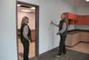 Jennifer Schmidt-Hutchins and Chris Whittingon-Evans examine an administration room in the under-construction Fronteras Charter School May 17. Teachers will begin moving into the building sta
