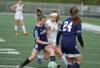Homer freshman Eve Brau (6) works against Wasilla senior Ally Hull (3) for possesion during Wasilla's 4-1 win over the Mariners in the Northern Lights Conference Championships quarterfinals T