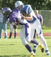 JEREMIAH BARTZ/Frontiersman file photo Palmer defensive back
Tanner Grover, right, sacks Lathrop quarterback Derrick Stevenson
for a loss during his junior season with the Moose. After two
st