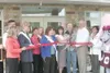 TODD L. DISHER/Frontiersman Primrose Retirement Community nurse
Manager Kristen Woods and founder and president Jim Thares, along
with other dignitaries, cut the ribbon at a opening ceremony
