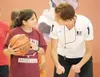 Gabby Kelly, left, gets some one-on-one instruction from
Pebley.