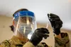 Army Spc. Ying Chen, a New York National Guardsman, prepares a dosage of the Pfizer-BioNTech COVID-19 vaccine at the Camp Smith Training Site Medical Readiness Clinic, N.Y., Dec. 18, 2020. Th