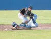 Alaska Road Warrior Ben Ross slides into second base as Chugiak’s Chase Wilson tags him. ROBERT DeBERRY/Frontiersman.com