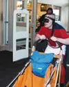 Palmer Fred Meyer store director John Mayer dressed up as
"Underdog Man" and entered the store via dog sled. Photo by JEN
RANSOM/Frontiersman.