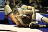 West's Chris Weidner tries to push away Colony sophomore Robert Haan just before Haan pins Weidner during the 160-pound final of the Lancer Smith Memorial at Palmer High School Nov. 22. Jerem
