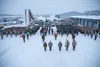 Soldiers with 3rd Battalion, 66th Armored Regiment (3-66), 1st Armored Brigade Combat Team, 1st Infantry Division and soldiers from multiple nations stand in formation at the closing ceremony