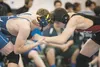 Palmer’s Eli Fouch and Houston’s Adam Hanohano grapple at 145 pounds at the Palmer Duals Nov. 21 at Palmer High School. ROBERT DeBERRY/Frontiersman