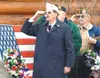 Veterans stand and salute while the flags of Alaska, POW/MIA and
America are raised Tuesday at the Veterans' Wall of Honor. Photo by
CASEY RESSLER/Frontiersman.