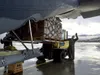 JOINT BASE ELMENDORF-RICHARDSON, Alaska -- Alaska Air National Guardsmen of 211th Rescue Squadron and 176th Logistics Readiness Squadron load relief supplies bound for Bethel Sept. 29, 2022, 