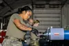 U.S. Air Force Airman 1st Class Daelyn Mayer, a 354th Maintenance Squadron conventional maintenance inspector, tightens a GBU-12 forward adapter at Eielson Air Force Base, Alaska, June 16, 20