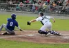 Mat-Su Miners catcher Sam Thompson tries to put the tag on Anchorage’s Malcom Tipler during a 5-1 loss to the Pilots. Jeremiah Bartz/Fronitersman