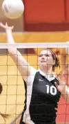 Colony junior Shellina Irwin spikes the ball past the Homer
Mariners Thursday during the quarter finals of the region III
tournament at Wasilla High School. (ROBERT
DeBERRY/Frontiersman)