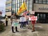 Protestors stood in front of the Anchorage Legislative Information Office. Tim Bradner/For the Frontiersman