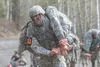 Wyoming Army National Guard Spc. Wyatt Schiermeyer evacuates a simulated casualty while competing in the National Guard Best Warrior Region VI 2018 at Joint Base Elmendorf-Richardson, Alaska,