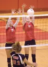 Wasilla Warriors Kayla Bell, left, and Haley Taylor block a
Kenai shot during Saturday's game at Wasilla High School. (ROBERT
DeBERRY/Frontiersman)
