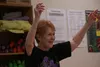 Barbara Carr waves her hands in the air during a Zumba Gold class hosted by Pam Doerr at Mat-Su Senior Services on Wednesday afternoon, Sept. 23. CAITLIN SKVORC/Frontiersman.com