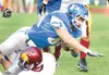 ROBERT DeBERRY/Frontiersman Palmer junior fullback John Scoresby
dives for extra yardage during Saturday’s game against the Dimond
Lynx.