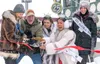 Alaska Senators Dan Sullivan and Lisa Murkowski cut the opening ribbon with state beauty pageant royalty during the Iditarod's ceremonial start in downtown Anchorage Saturday morning. J. Davi