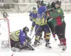 ROBERT DeBERRY/Frontiersman Avalanche goal tender Austin
McGinnis drops on the puck as Avalanche defenseman Jason Cohen and
Kenai Brown Bear forward Kevin Wentland trade punches during the
se