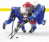 Palmer's Ashton Johnson (26) and Thomas Foster (24) battle for the puck against Wasilla's Matthew DeMaster. Bruce Eggleston/matsusports.net