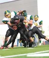 Houston’s Waylon Soptick is tackled during a recent game at Houston High School. Soptick needs 204 yards rushing against Homer tonight to break the school’s all-time record. ROBERT DeBERRY/Fr