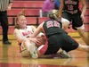 Wasilla’s Shayla Johnson fights for the ball against Juneau’s Kaitlin Fagerstrom during Wasilla’s 50-28 win during the Doc Larson’s Roundball Classic Thursday at Wasilla High School. ROBERT D