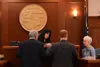 From left to right, House Majority Leader Dan Saddler, R-Eagle River; Speaker of the House Cathy Tilton, R-Wasilla; and Rep. David Eastman, R-Wasilla; listen to House Clerk Kris Jones during 
