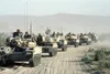M551 Sheridan light tanks cross the desert during an Opposing Forces exercise at the National Training Center. The tanks have visual modifications designed to make it resemble Soviet armor. W