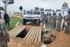 West Virginia National Guardsmen show members of the Peruvian military how to do field maintenance of Humvees. The Peruvian soldiers deployed as part of an international peacekeeping mission 