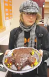 Allie Eby, a senior at Houston High School, shows off her Mole
Day cake in chemistry class. (KATIE JENSEN/Houston High School)