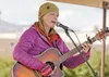 Melanie Trost performs across the street from the Palmer Museum of History and Art during a Second Saturday event in Palmer. ROBERT DeBERRY/Frontiersman