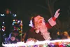 Santa Claus waves to the crowd from the Greater Palmer Chamber of Commerce Parade of Lights, entry. HEATHER A. RESZ/Frontiersman