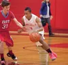 Wasilla’s Cameron brown drives past East High Thunderbird Brayton Keith during Friday’s game at the Doc Larson’s Roundball Classic at Wasilla High School. ROBERT DeBERRY/Frontiersman.com