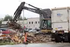 The last of the rubble from the old Salvation Army building in Palmer is hauled away to make room for a new medical facility. MATT HICKMAN/Frontiersman