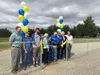 Officials from Palmer's First Baptist Church and Palmer city and Borough officials, including city Mayor Edna Devries and Borough Manager John Moosey, cut a ribbon at the new Friendship Park 
