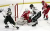 Colony sophomore forwards Cooper Smith and Jake Hessinger try to push the puck past Wasilla goaltender Zach Curry during Colony's 4-2 loss to Wasilla earlier this season. Colony and Wasilla m