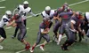 Wasilla senior Sean McDermott follows his blockers through a hole during a 30-0 win over Eagle River Aug. 18 at Wasilla High School. The Warriors broke a nine-game losing streak at home with 
